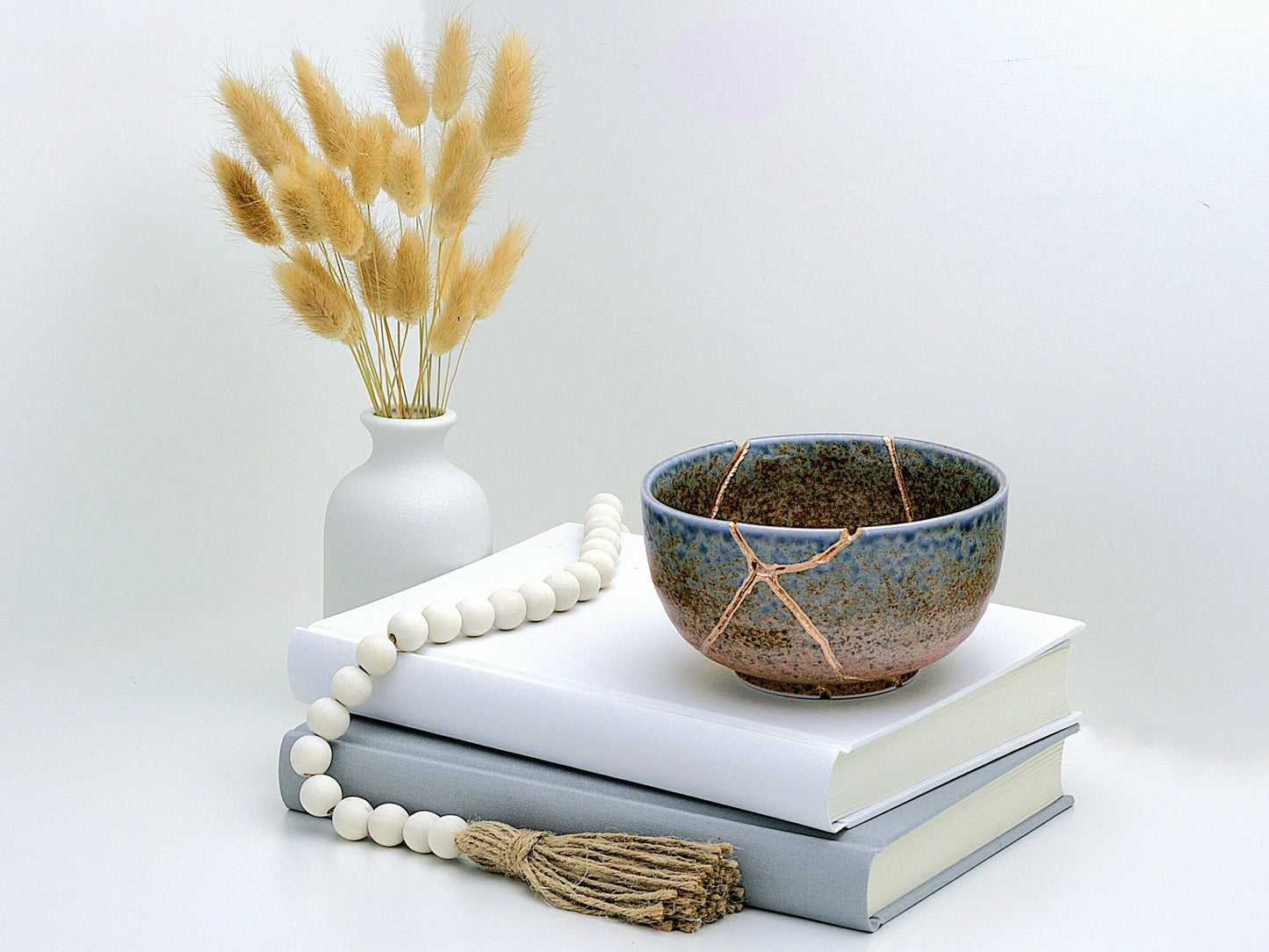 Large Brown and Blue Kintsugi Bowl showing item being used as a decoration - Kintsugi Reborn, LLC.